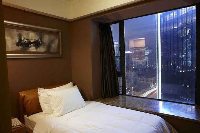 Imagen de la habitación del Aparthotel Dan Executive Apartment Guangzhou. Foto 9