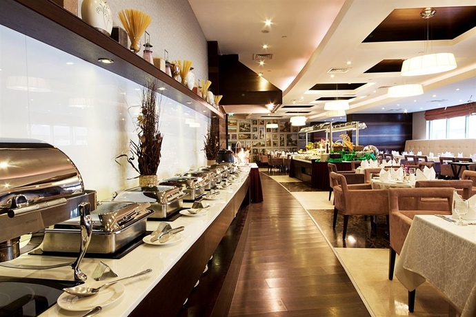 Imagen del bar/restaurante del Aparthotel Grand Belle Vue Hotel Apartment Dubai. Foto 3