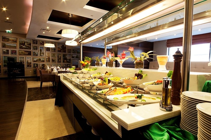 Imagen del bar/restaurante del Aparthotel Grand Belle Vue Hotel Apartment Dubai. Foto 4