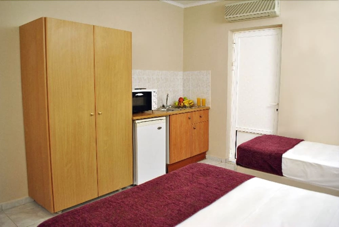 Imagen de la habitación del Aparthotel Hotel Plessas Palace. Foto 11
