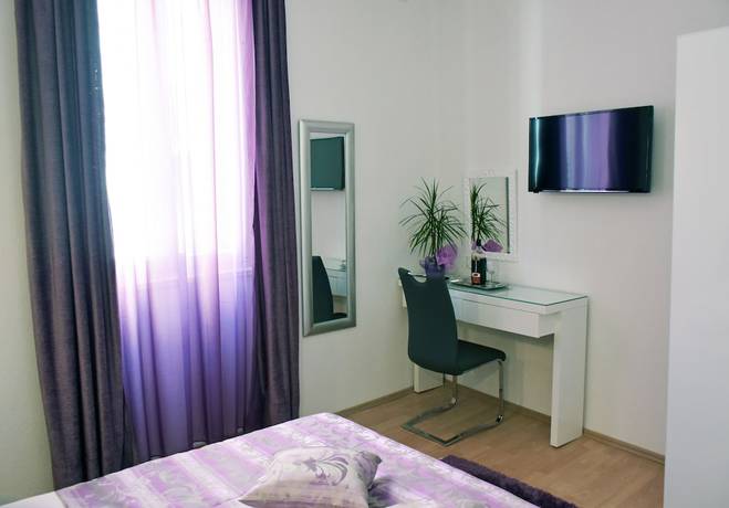 Imagen de la habitación del Aparthotel Kuzma Rooms. Foto 6