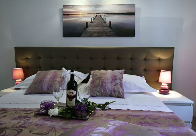 Imagen de la habitación del Aparthotel Kuzma Rooms. Foto 8