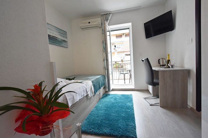 Imagen de la habitación del Aparthotel Kuzma Rooms. Foto 9