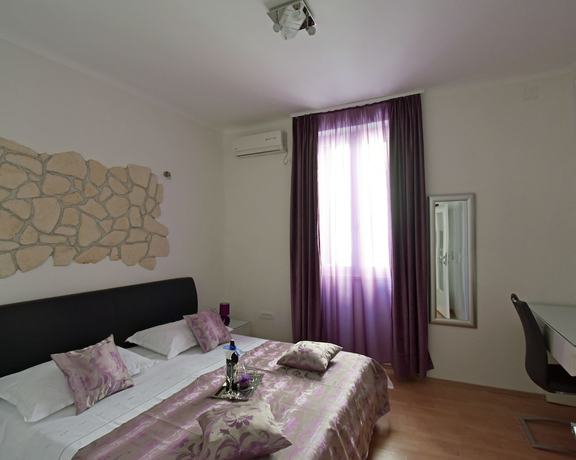Imagen de la habitación del Aparthotel Kuzma Rooms. Foto 13