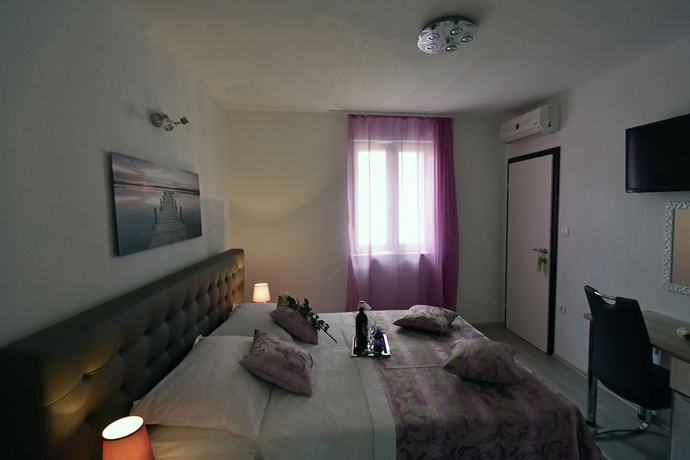 Imagen de la habitación del Aparthotel Kuzma Rooms. Foto 15