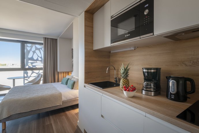 Imagen de la habitación del Aparthotel Lagrange Apart'hotel Les Jardins D'olympie. Foto 6