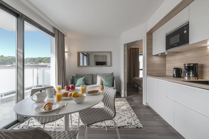 Imagen de la habitación del Aparthotel Lagrange Apart'hotel Les Jardins D'olympie. Foto 8