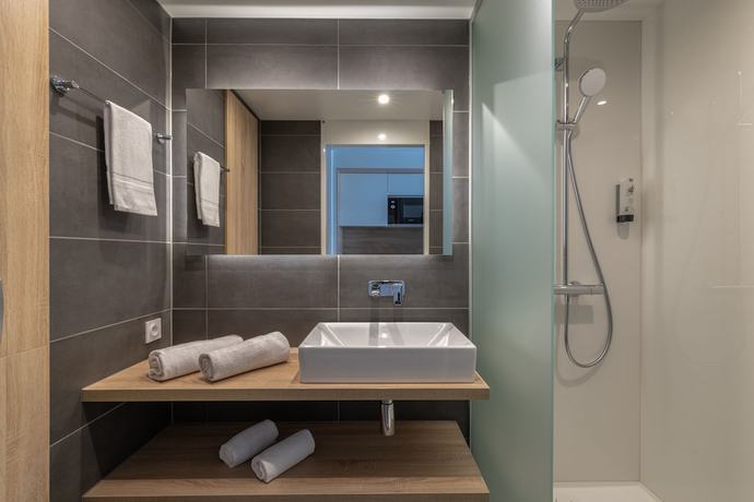 Imagen de la habitación del Aparthotel Lagrange Apart'hotel Les Jardins D'olympie. Foto 9