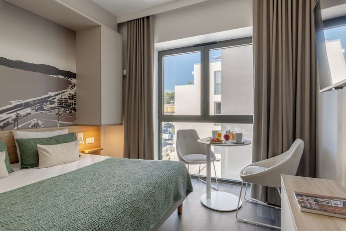 Imagen de la habitación del Aparthotel Lagrange Apart'hotel Les Jardins D'olympie. Foto 17