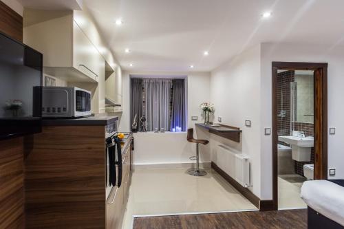 Imagen de la habitación del Aparthotel Livin' Serviced Apartments. Foto 6