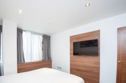 Imagen de la habitación del Aparthotel Livin' Serviced Apartments. Foto 8
