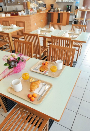 Imagen del bar/restaurante del Aparthotel S&eacute;jours Et Affaires Tours L&eacute;onard De Vinci. Foto 6