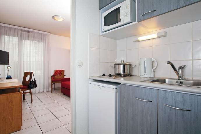 Imagen de la habitación del Aparthotel S&eacute;jours and Affaires Lyon Park Lane. Foto 12