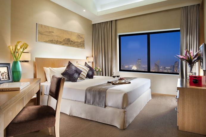 Imagen de los interiores del Aparthotel Somerset International Building Tianjin. Foto 16