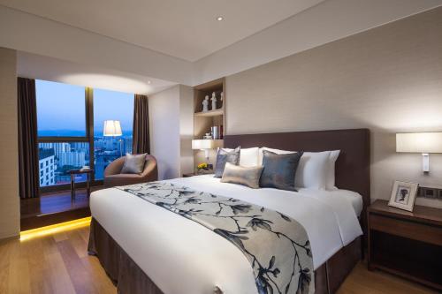 Imagen de la habitación del Aparthotel Somerset Xindicheng Xi'an. Foto 6