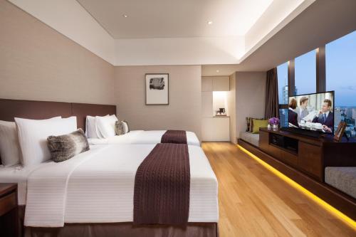 Imagen de la habitación del Aparthotel Somerset Xindicheng Xi'an. Foto 7
