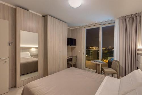 Imagen de la habitación del Aparthotel Sunrise Palace, Lido Di Jesolo. Foto 6