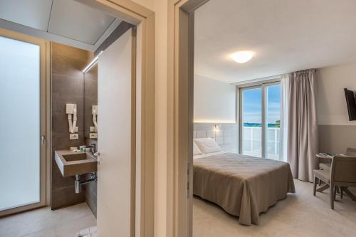 Imagen de la habitación del Aparthotel Sunrise Palace, Lido Di Jesolo. Foto 10