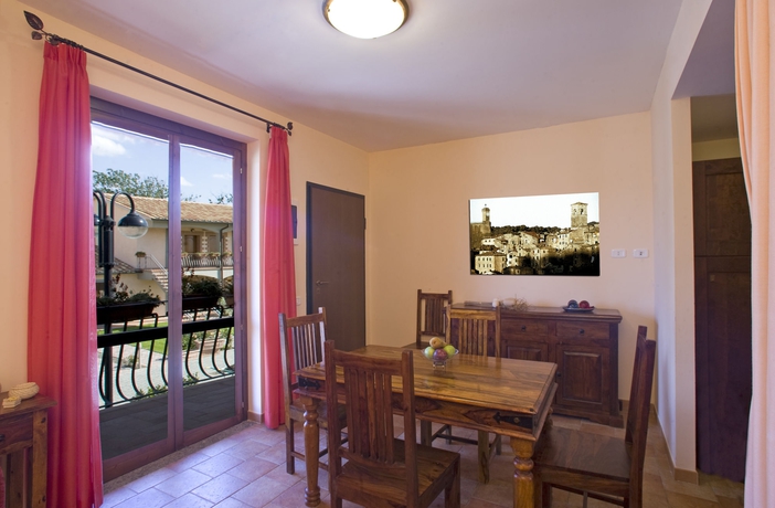Imagen de la habitación del Aparthotel Villaggio Le Querce. Foto 1