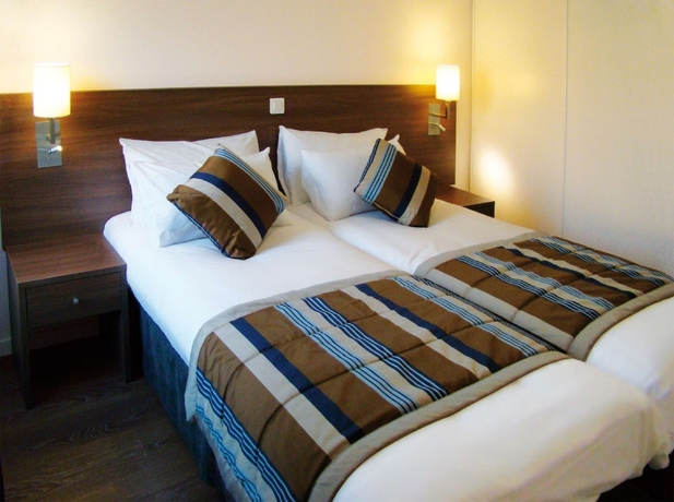 Imagen de la habitación del Aparthotel Zenitude H&ocirc;tel R&eacute;sidences Roissy Village. Foto 8