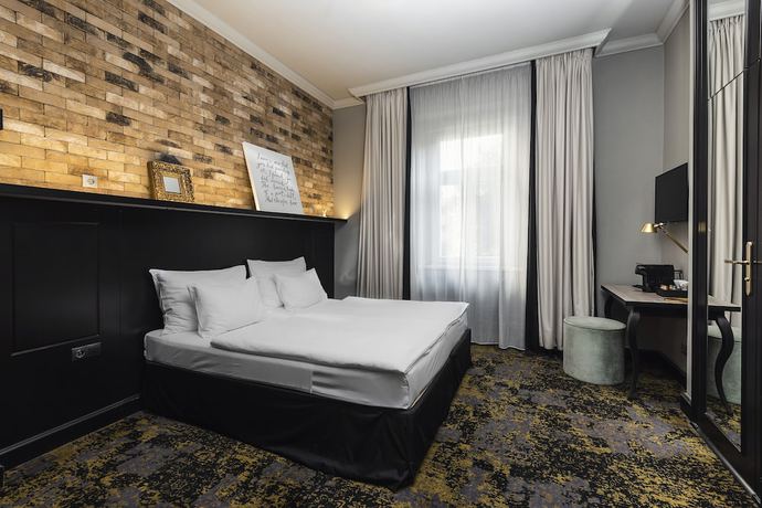 Imagen de la habitación del Aparthotel numa l Root Rooms & Apartments. Foto 6