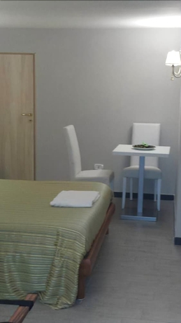 Imagen de la habitación del B&B La Dimora Di Nettuno. Foto 9