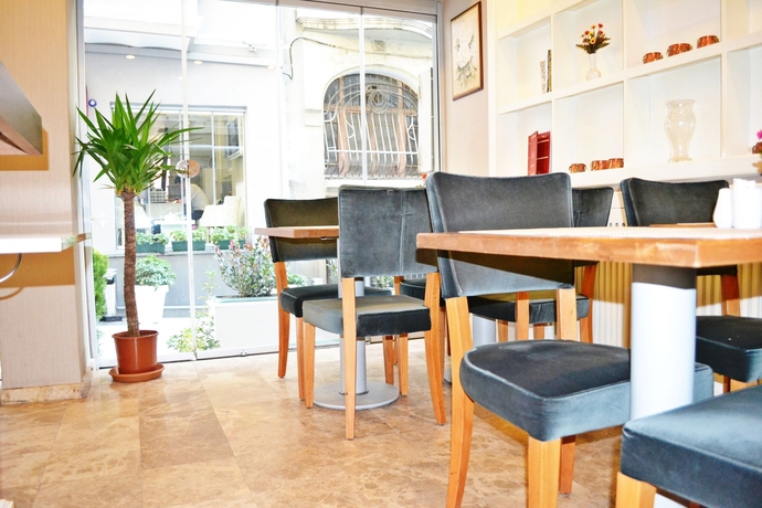 Imagen del bar/restaurante del Boutique Alyon Suite Hotel. Foto 3