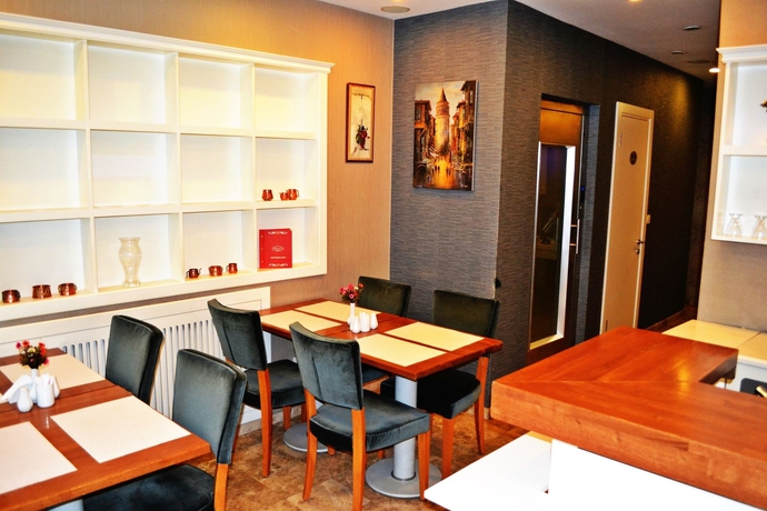 Imagen del bar/restaurante del Boutique Alyon Suite Hotel. Foto 6