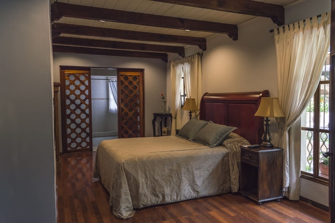 Imagen de la habitación del Boutique Casa Santa Rosa Hotel. Foto 2