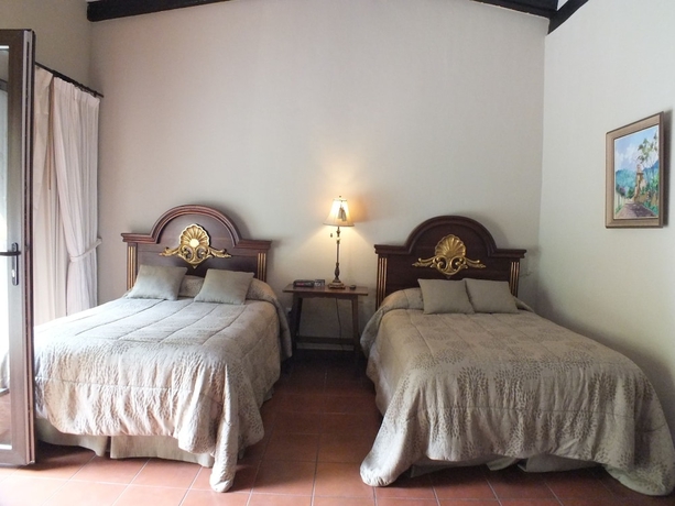 Imagen de la habitación del Boutique Casa Santa Rosa Hotel. Foto 6