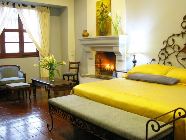 Imagen de la habitación del Boutique Casa Santa Rosa Hotel. Foto 7