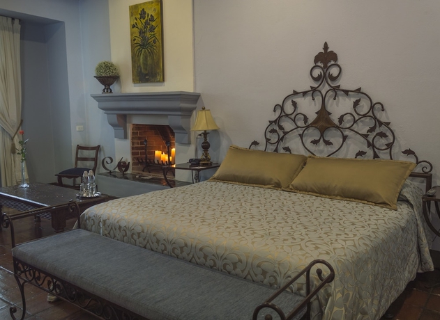 Imagen de la habitación del Boutique Casa Santa Rosa Hotel. Foto 8