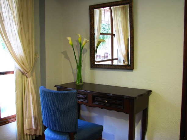 Imagen de la habitación del Boutique Casa Santa Rosa Hotel. Foto 11