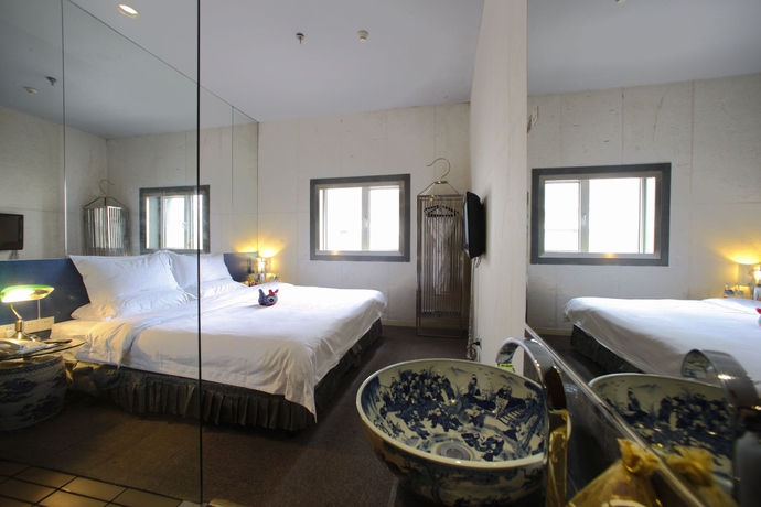 Imagen de la habitación del Boutique China Community Art Habitat Hotel. Foto 4