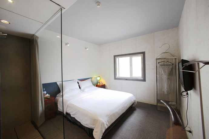Imagen de la habitación del Boutique China Community Art Habitat Hotel. Foto 5
