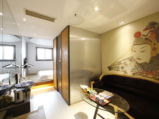 Imagen de la habitación del Boutique China Community Art Habitat Hotel. Foto 10