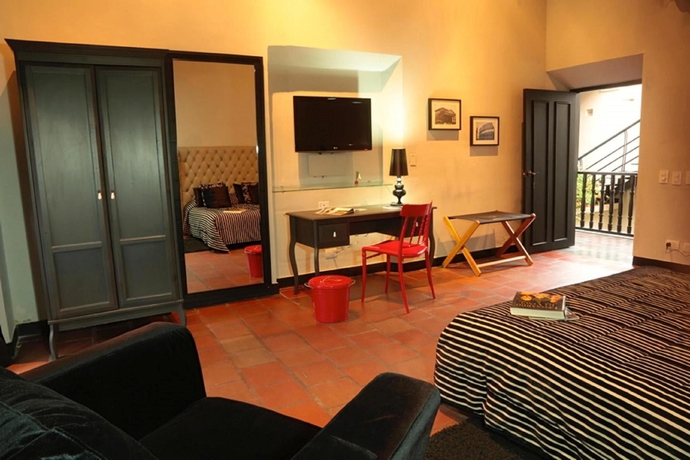 Imagen de la habitación del Boutique La Casa Del Farol Boutique. Foto 5