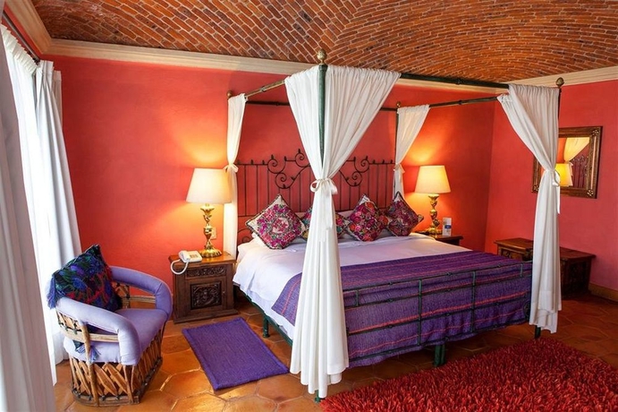 Imagen de la habitación del Boutique La Puertecita Hotel. Foto 12