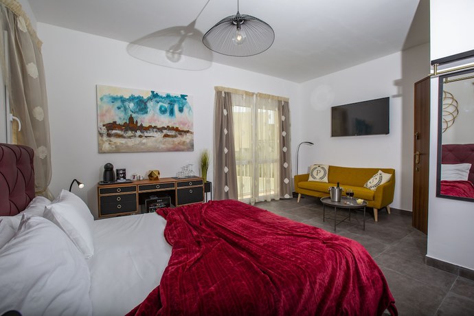 Imagen de la habitación del Boutique Pjazza Suites. Foto 13