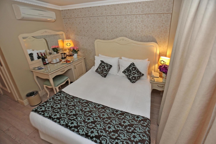 Imagen de la habitación del Boutique Raymond Hotel. Foto 6