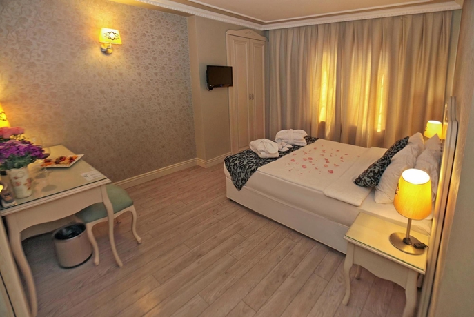 Imagen de la habitación del Boutique Raymond Hotel. Foto 9