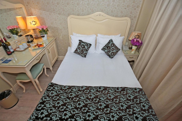 Imagen de la habitación del Boutique Raymond Hotel. Foto 11