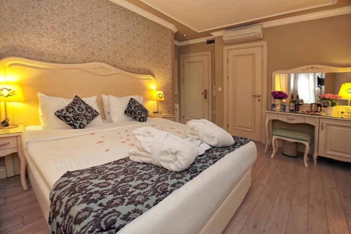 Imagen de la habitación del Boutique Raymond Hotel. Foto 14