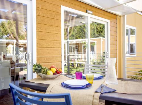 Imagen de la habitación del Camping Village Baia Azzurra Club. Foto 10