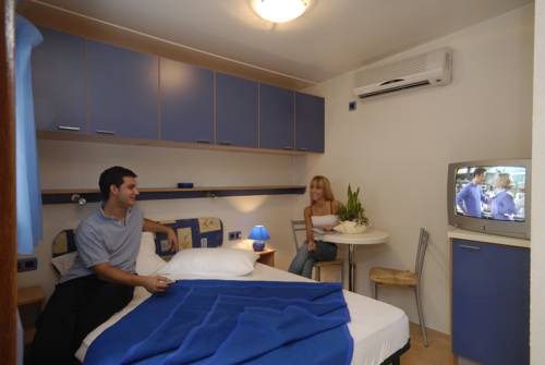 Imagen de la habitación del Camping Village Baia Blu La Tortuga. Foto 14