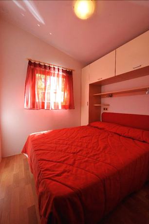 Imagen de la habitación del Camping Village Capo D'orso. Foto 12