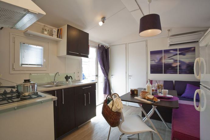 Imagen de la habitación del Camping Village Punta Navaccia. Foto 15