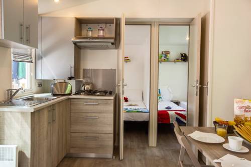 Imagen de la habitación del Camping hu Altomincio Village. Foto 15