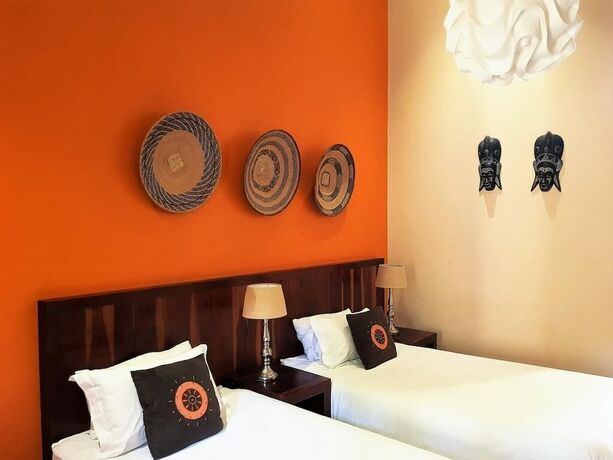 Imagen de la habitación del Casa de Huéspedes African Roots Guest House. Foto 18