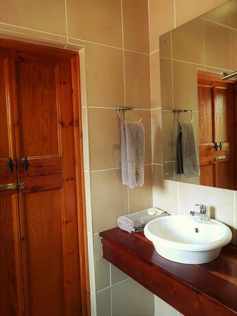 Imagen de la habitación del Casa de Huéspedes African Roots Guest House. Foto 25